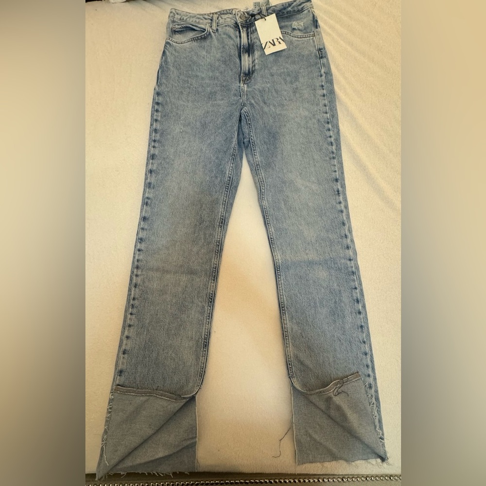 Light blue jeans with slit